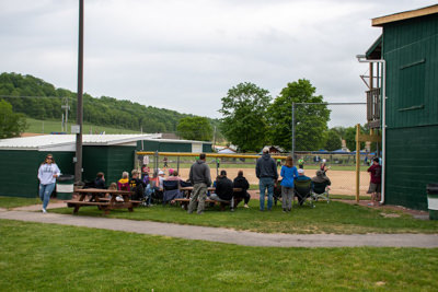 Fans watching the softball game.