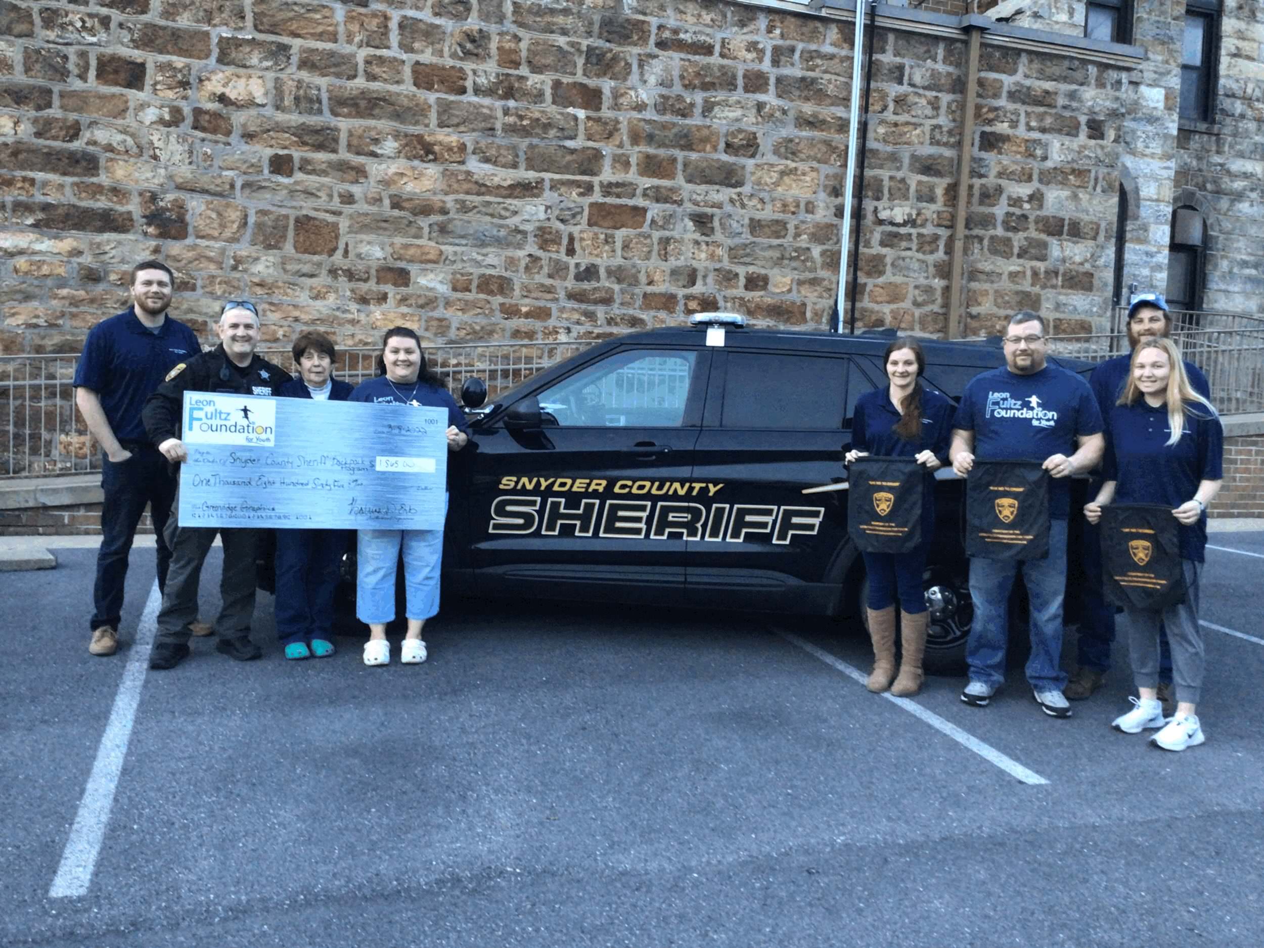 Foundation board members presenting a check to the Snyder County Sheriff's Department